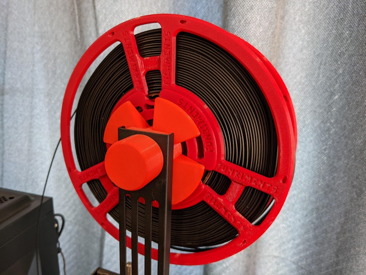 Funkiments printed spool, with black PLA loaded